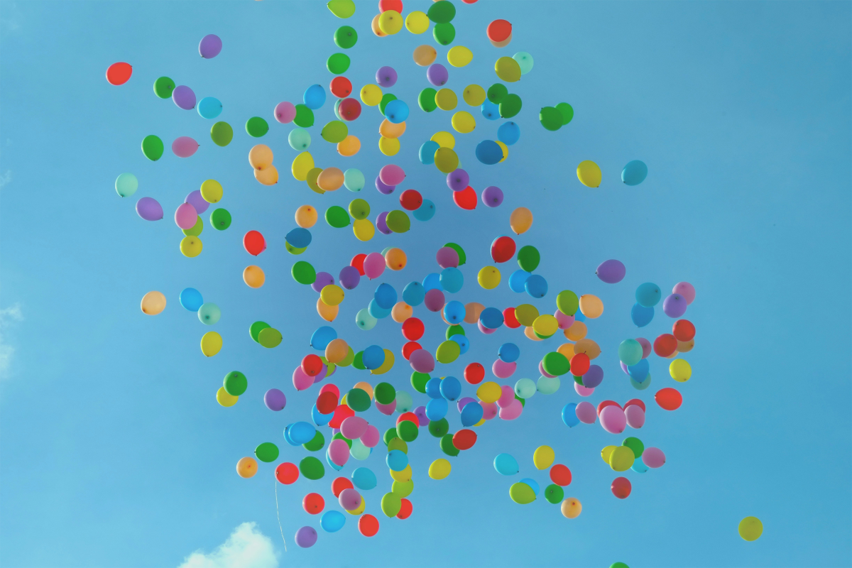 Balloons flying in the sky.