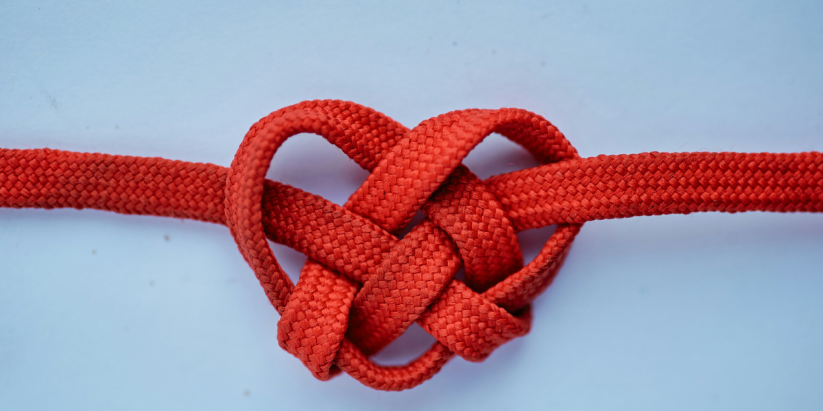 Knot tied together to form a heart.