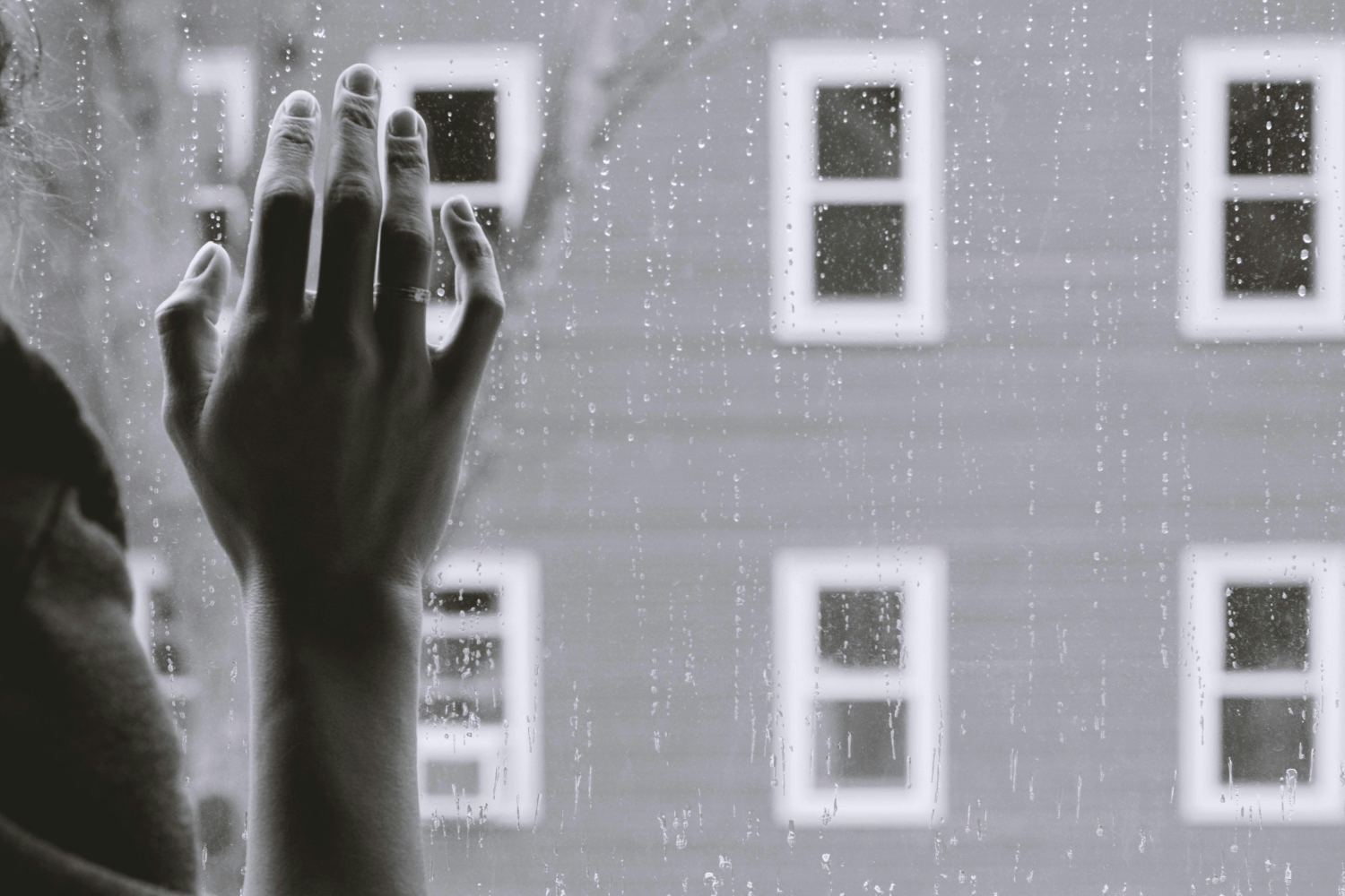 Hand on a window