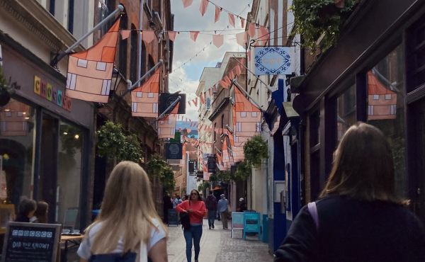 Student image of two students walking down the street.