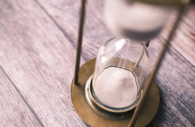 Hour glass with sand falling. 